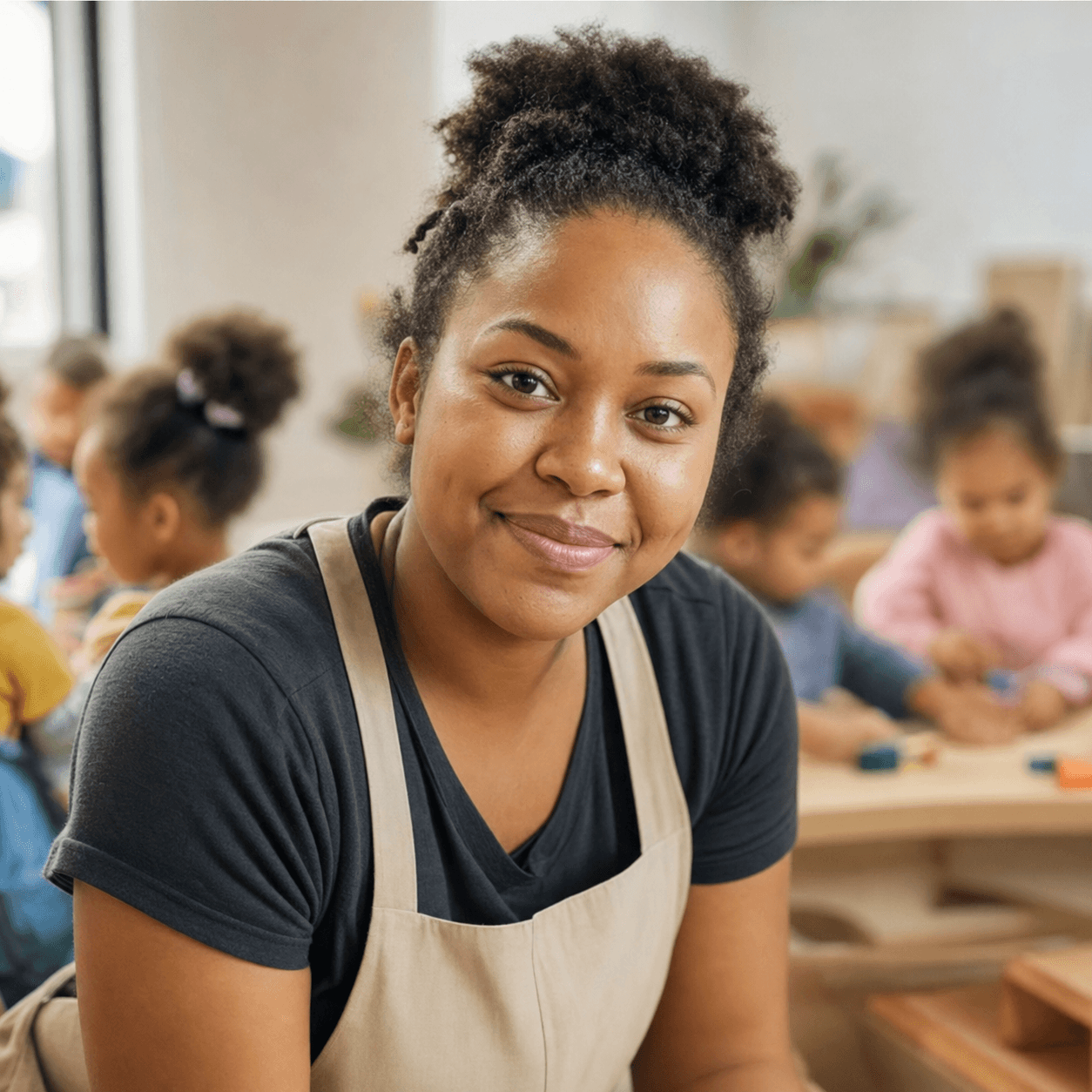 Amara, an Early Years Educator, smiling in a nursery